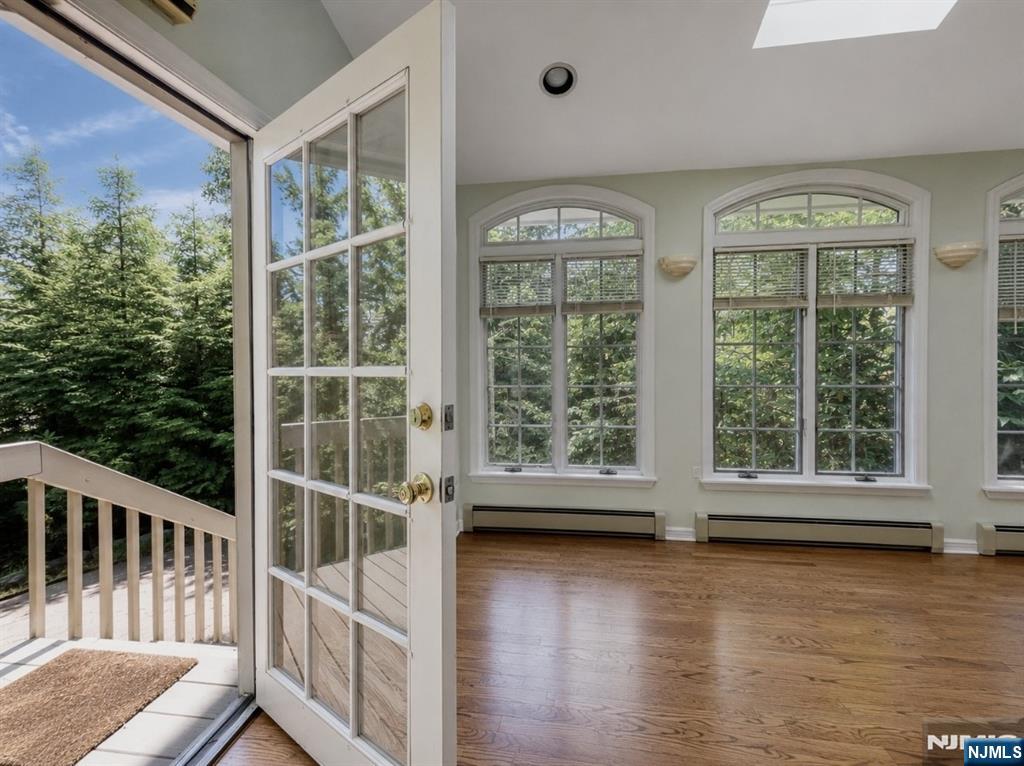 84 Valley View Avenue Ridgewood, NJ 07450 - Photo 8 of 20 a view of a room with wooden floor and windows
