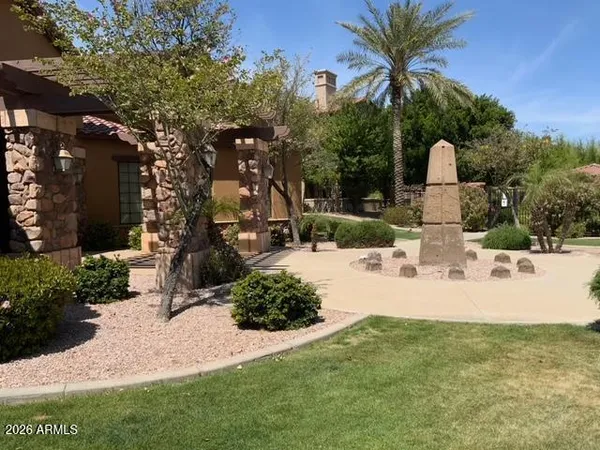 a view of a yard with plants and trees