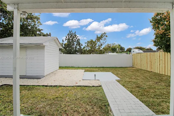 a backyard of a house with lots of green space