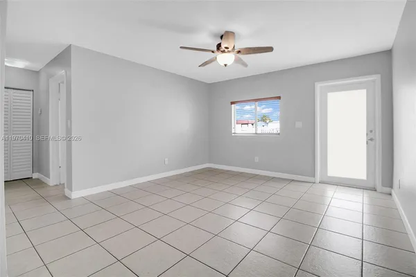 a view of an empty room with a window