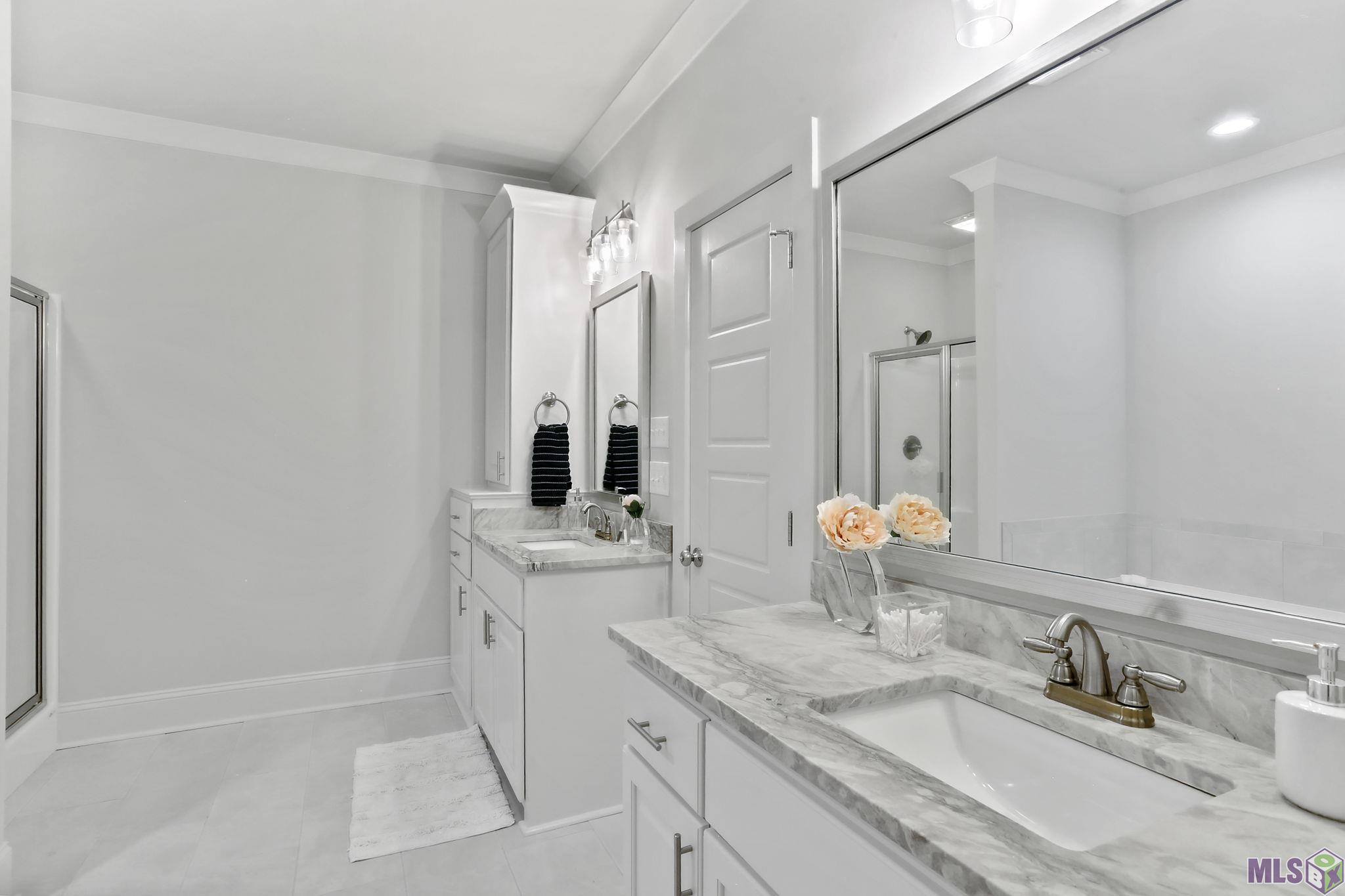 6613 Silver Oak Drive Baton Rouge, LA 70817 - Photo 15 of 18 Double vanities and Linen cabinet