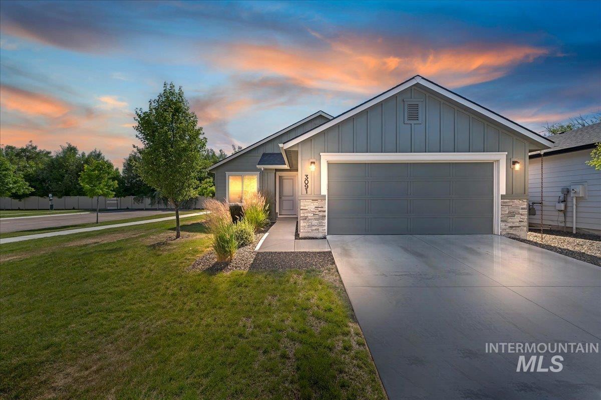 3091 S Green Boise, ID 83709 - Photo 1 of 27 Contemporary home exterior featuring board and batten siding with stone accents