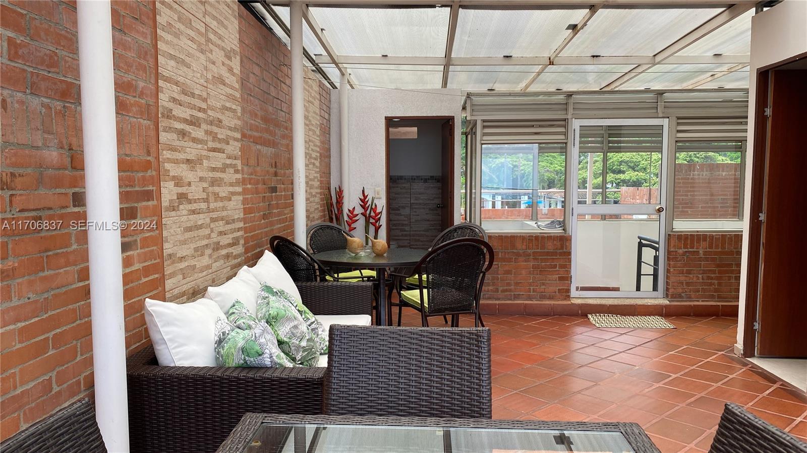 9 Avenida, Unit 1002 Arlington, CA 76004 - Photo 16 of 16 a outdoor living space with furniture and a potted plant