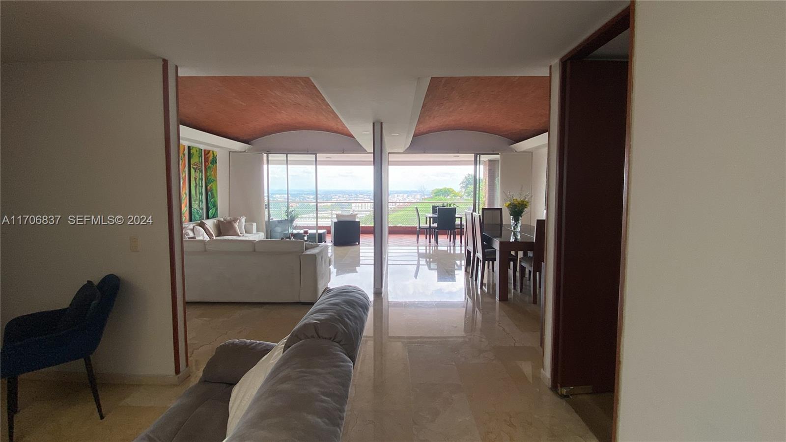 9 Avenida, Unit 1002 Arlington, CA 76004 - Photo 3 of 16 a living room with couches and balcony view