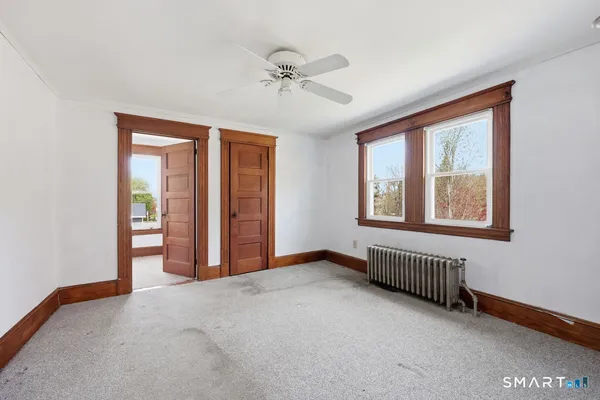 a view of an empty room with a window