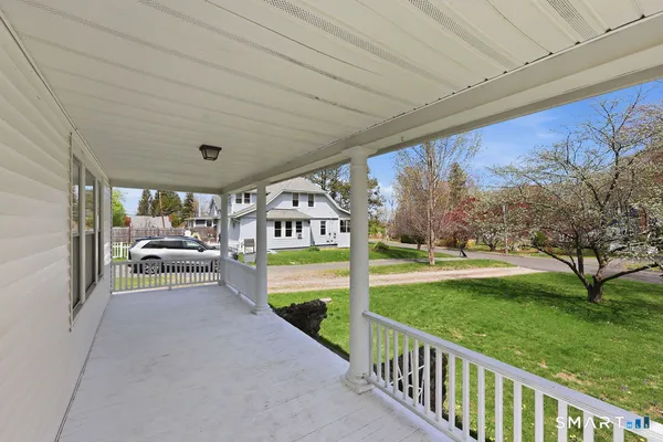 a view of a porch and garden