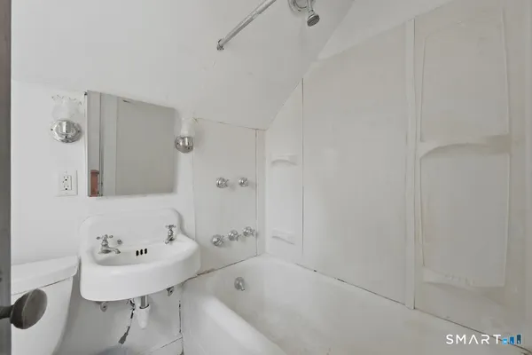 a bathroom with a sink and a bathtub