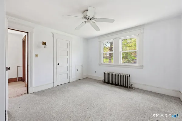 a view of room with window and ceiling fan