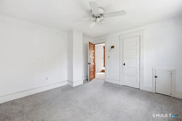 a view of a hallway with windows