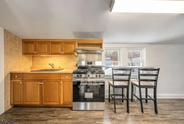 a kitchen with a stove and a cabinets