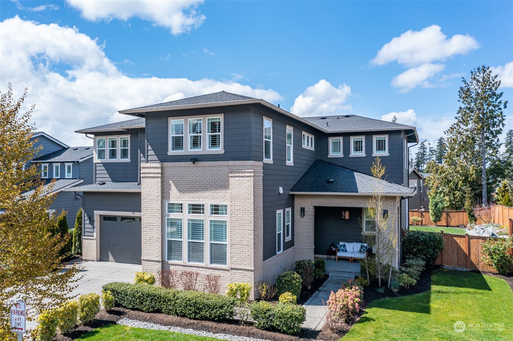 21814 34th Drive Southeast Bothell, WA 98021 - Photo 1 of 1 a front view of a house with garden