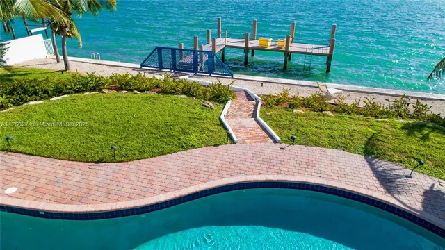 a view of a swimming pool with a patio