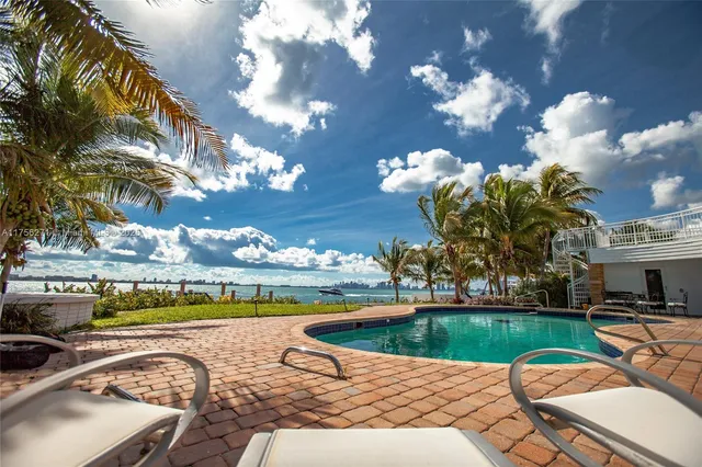 a view of a swimming pool with a garden