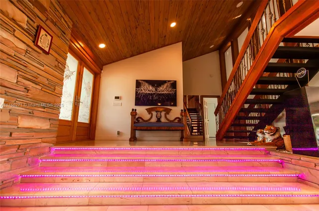 a view of hall way with furniture