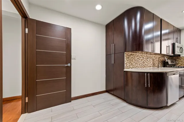 a view of kitchen with cabinets and outdoor space