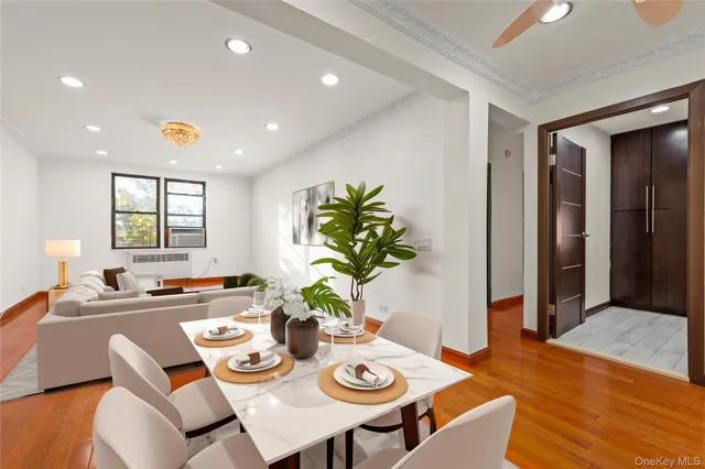 a view of a dining room with furniture window and wooden floor