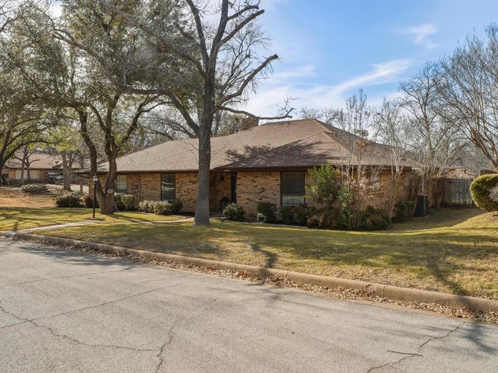 1662 Watson Road Fort Worth, TX 76103 - Photo 2 of 37 Ranch-style house with a chimney and brick siding