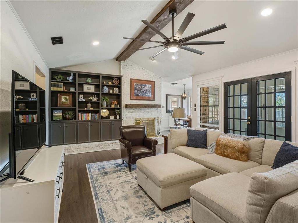 1662 Watson Road Fort Worth, TX 76103 - Photo 6 of 37 Living room with french doors, wood finished floors, beamed ceiling, ornamental molding, and a ceiling fan