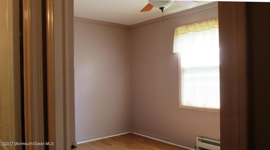 35 A Zacatin Road, Unit 1000 Freehold, NJ 07728 - Photo 12 of 16 a view of an empty room and window