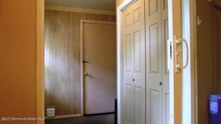 35 A Zacatin Road, Unit 1000 Freehold, NJ 07728 - Photo 3 of 16 a view of a bathroom with a glass door
