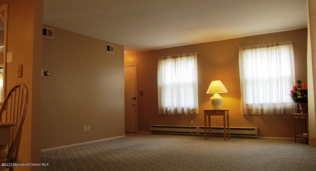 35 A Zacatin Road, Unit 1000 Freehold, NJ 07728 - Photo 8 of 16 a view of a room with gym equipment