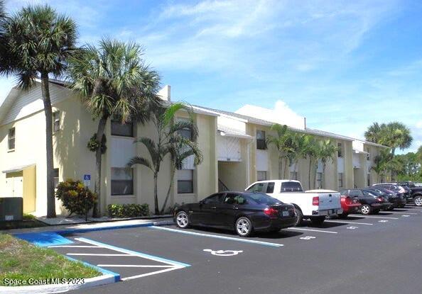 582 North Wickham Road, Unit 89 Melbourne, FL 32934 - Photo 1 of 25 a view of a cars parked on the side of a street