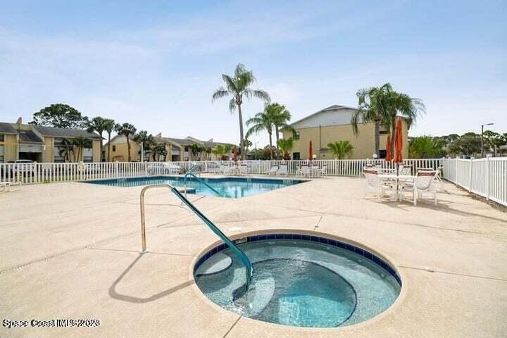 582 North Wickham Road, Unit 89 Melbourne, FL 32934 - Photo 18 of 25 a view of swimming pool and outdoor seating