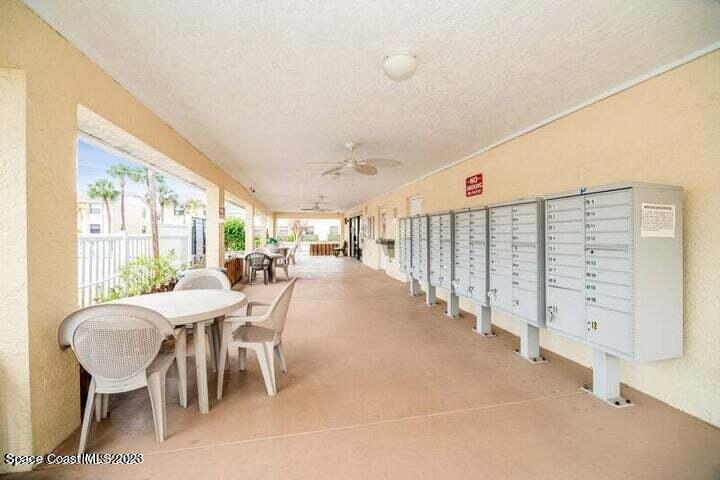582 North Wickham Road, Unit 89 Melbourne, FL 32934 - Photo 19 of 25 a dining room with furniture and a large window