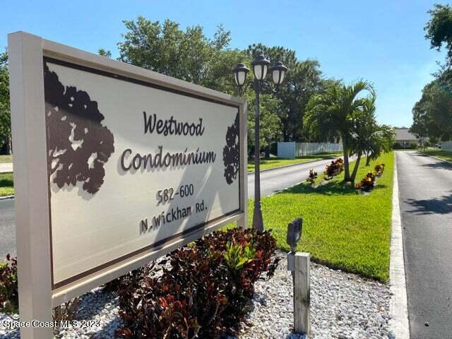 582 North Wickham Road, Unit 89 Melbourne, FL 32934 - Photo 20 of 25 a view of a sign in front of a house