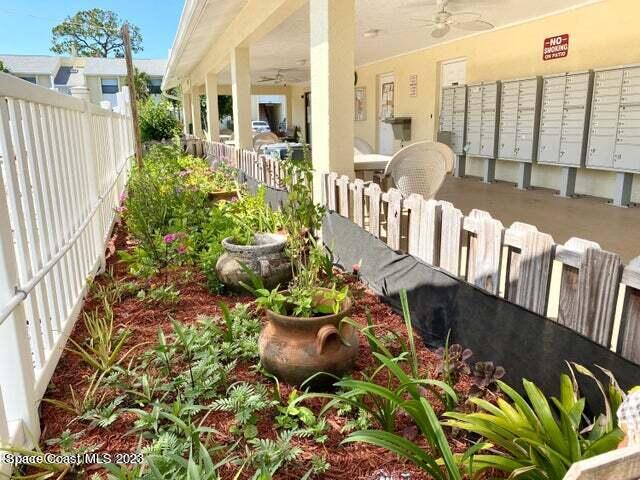 582 North Wickham Road, Unit 89 Melbourne, FL 32934 - Photo 21 of 25 a front view of a house with lots of potted plants