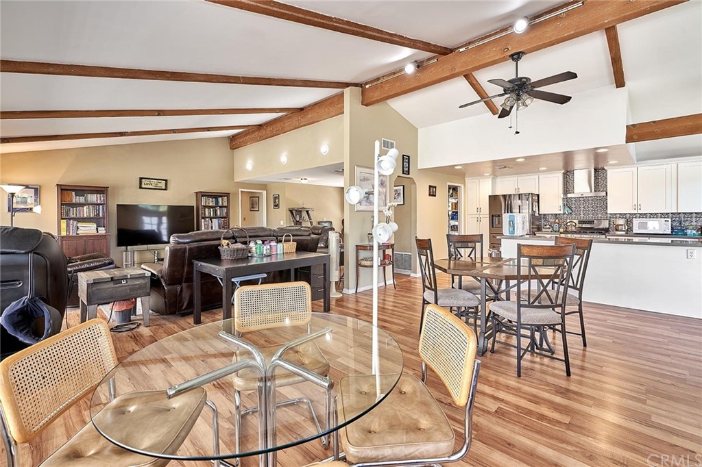 735 Huston Drive Riverside, CA 92507 - Photo 1 of 1 a room with lots of dining table chairs and wooden floors