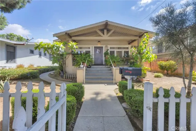 a view of a pathway both side of house