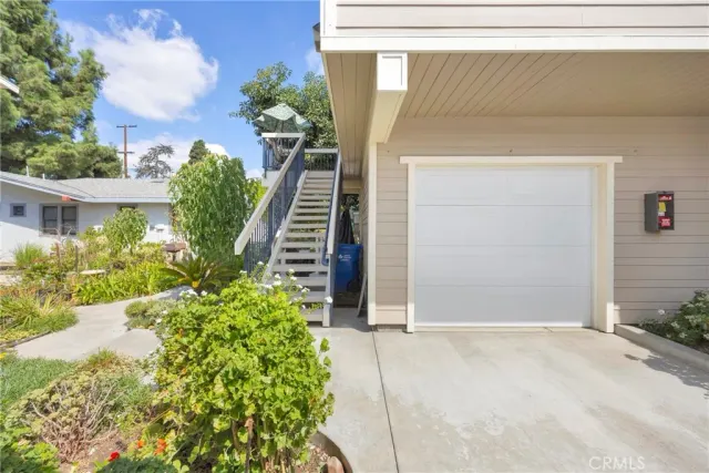 a large kitchen with stainless steel appliances granite countertop a lot of counter space and a sink