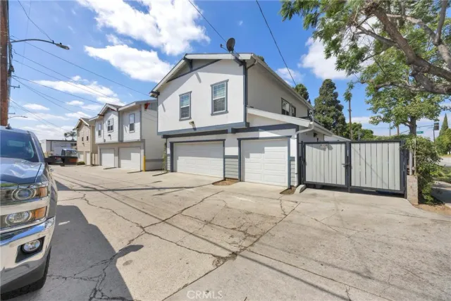 an aerial view of residential houses with outdoor space and street view