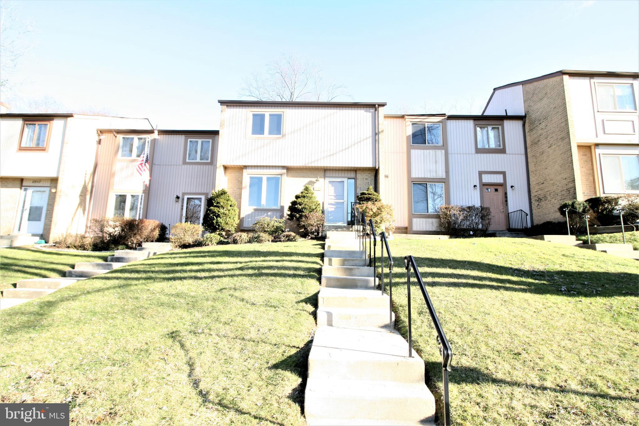 a swimming pool with outdoor seating and yard