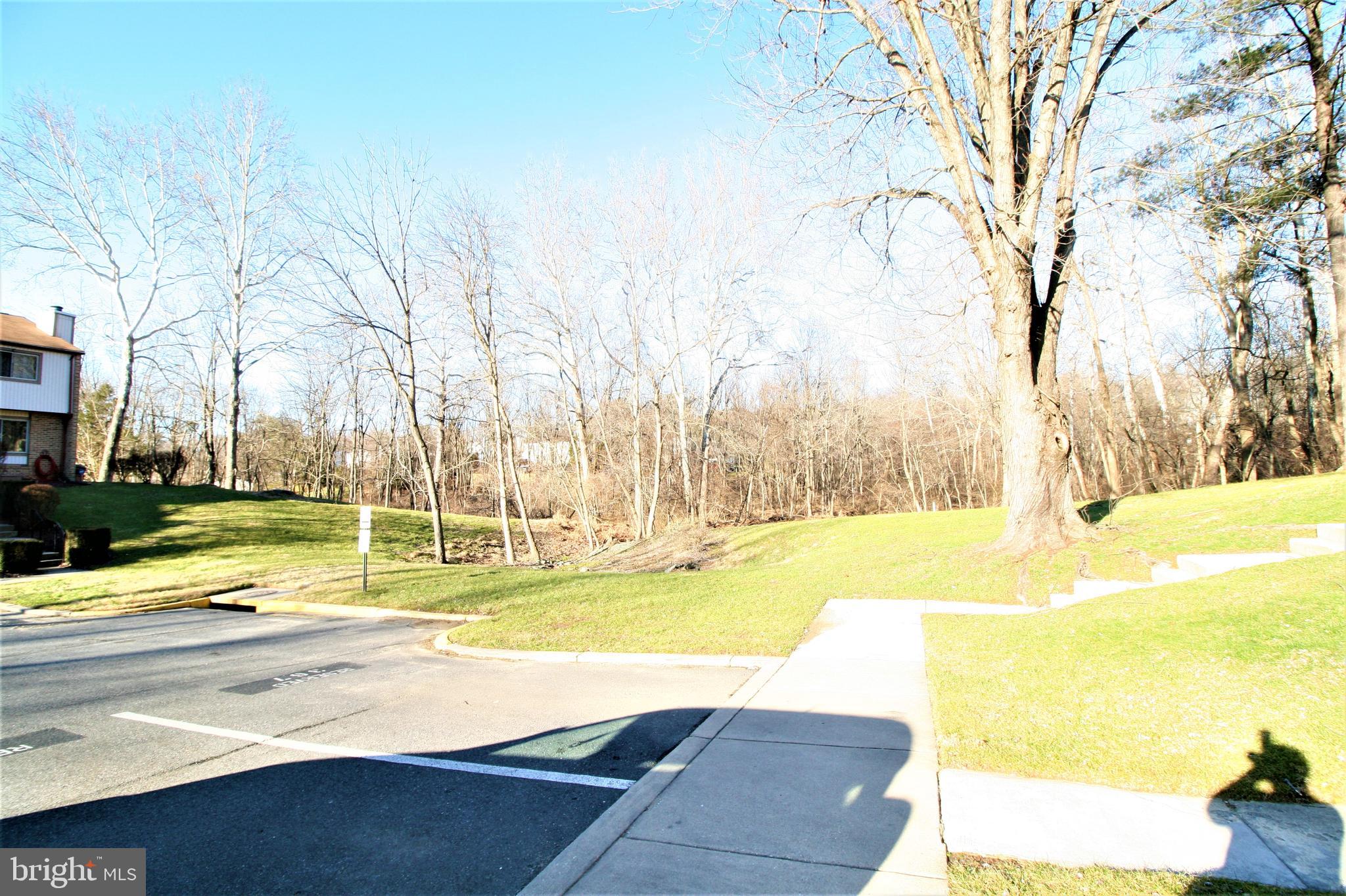8943 Centerway Road Gaithersburg, MD 20879 - Photo 34 of 34 a view of a swimming pool with an outdoor space and seating area