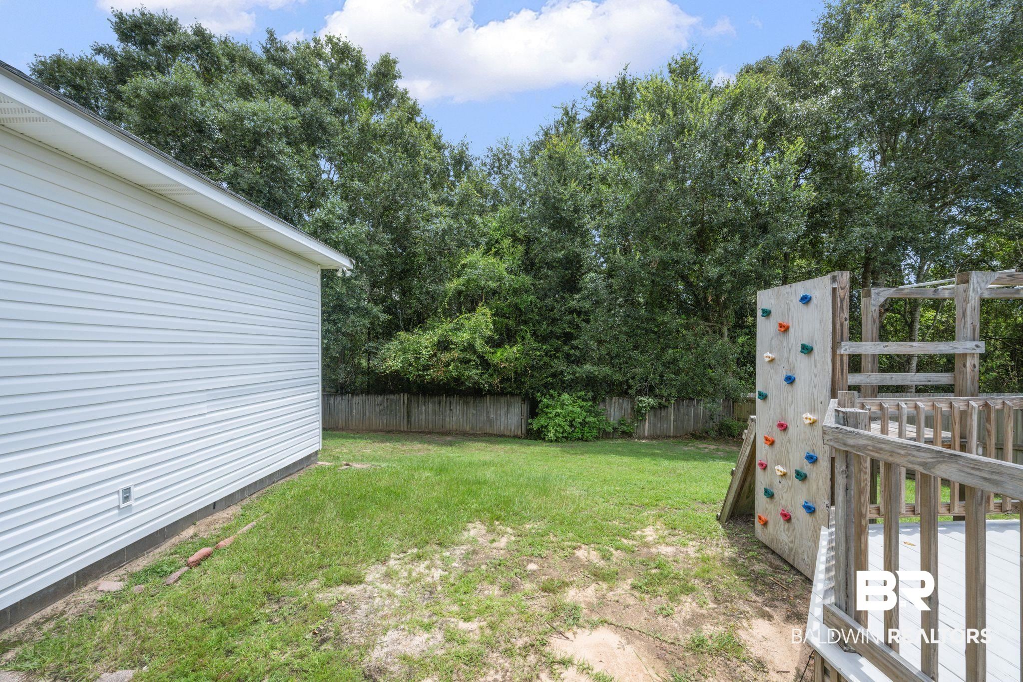 2041 Ridgeline Drive Mobile, AL 36695 - Photo 41 of 43 View of yard with a wooden deck