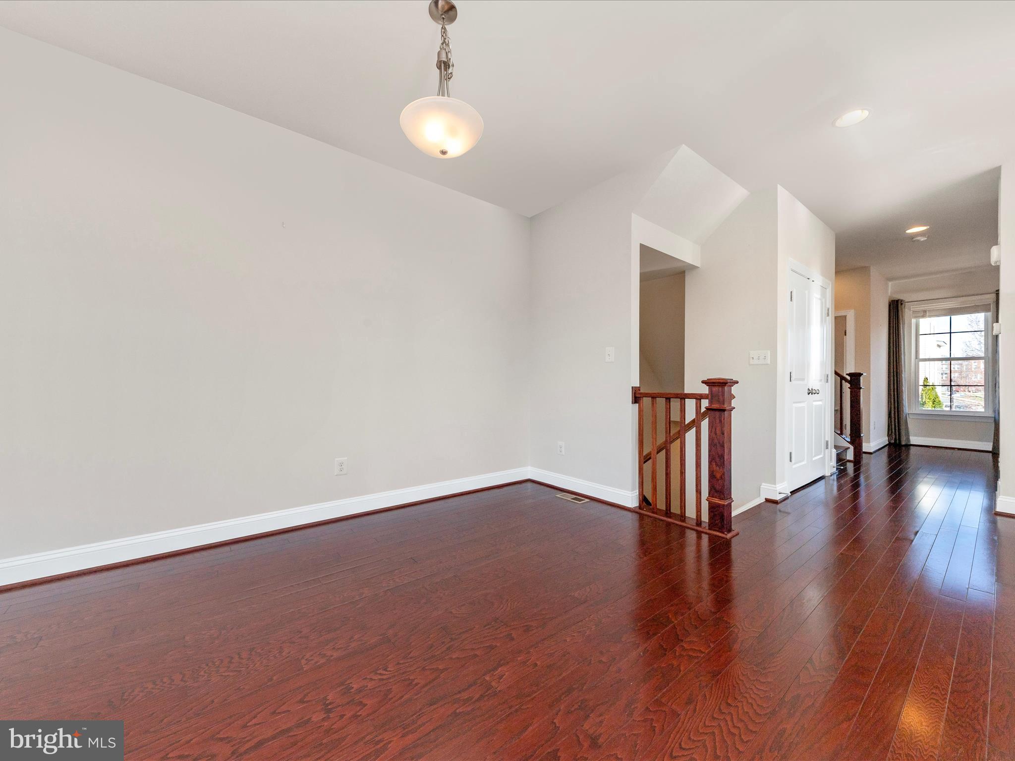 42251 Riggins Ridge Terrace Brambleton, VA 20148 - Photo 25 of 62 a view of a livingroom with wooden floor