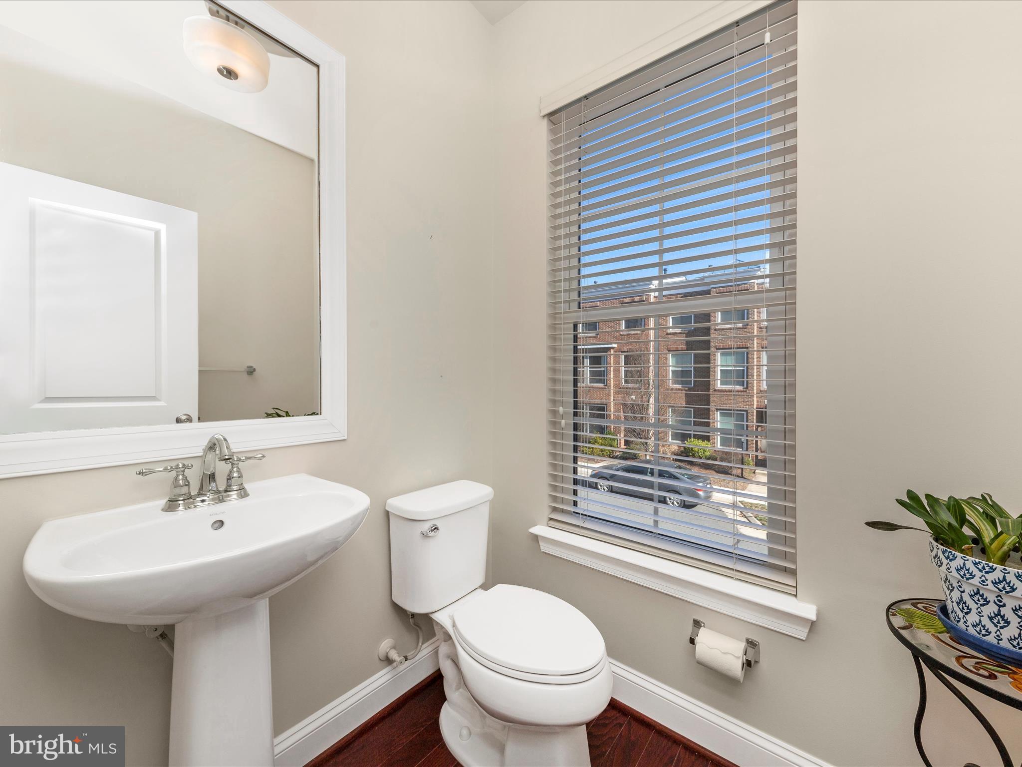 42251 Riggins Ridge Terrace Brambleton, VA 20148 - Photo 28 of 62 a bathroom with a sink a toilet and tub