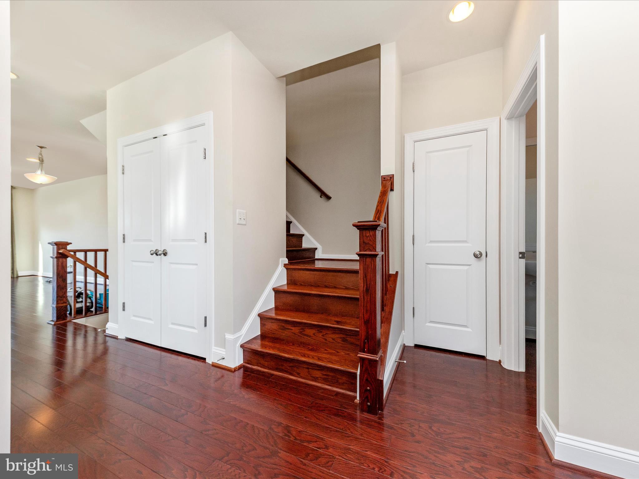 42251 Riggins Ridge Terrace Brambleton, VA 20148 - Photo 29 of 62 an empty room with wooden floor and windows