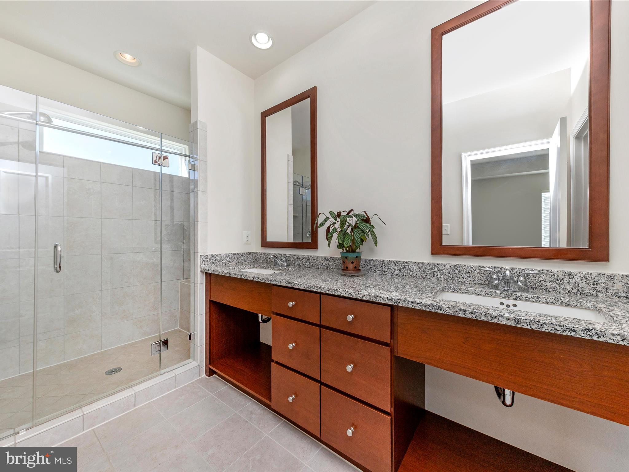 42251 Riggins Ridge Terrace Brambleton, VA 20148 - Photo 36 of 62 a bathroom with a granite countertop sink mirror and double
