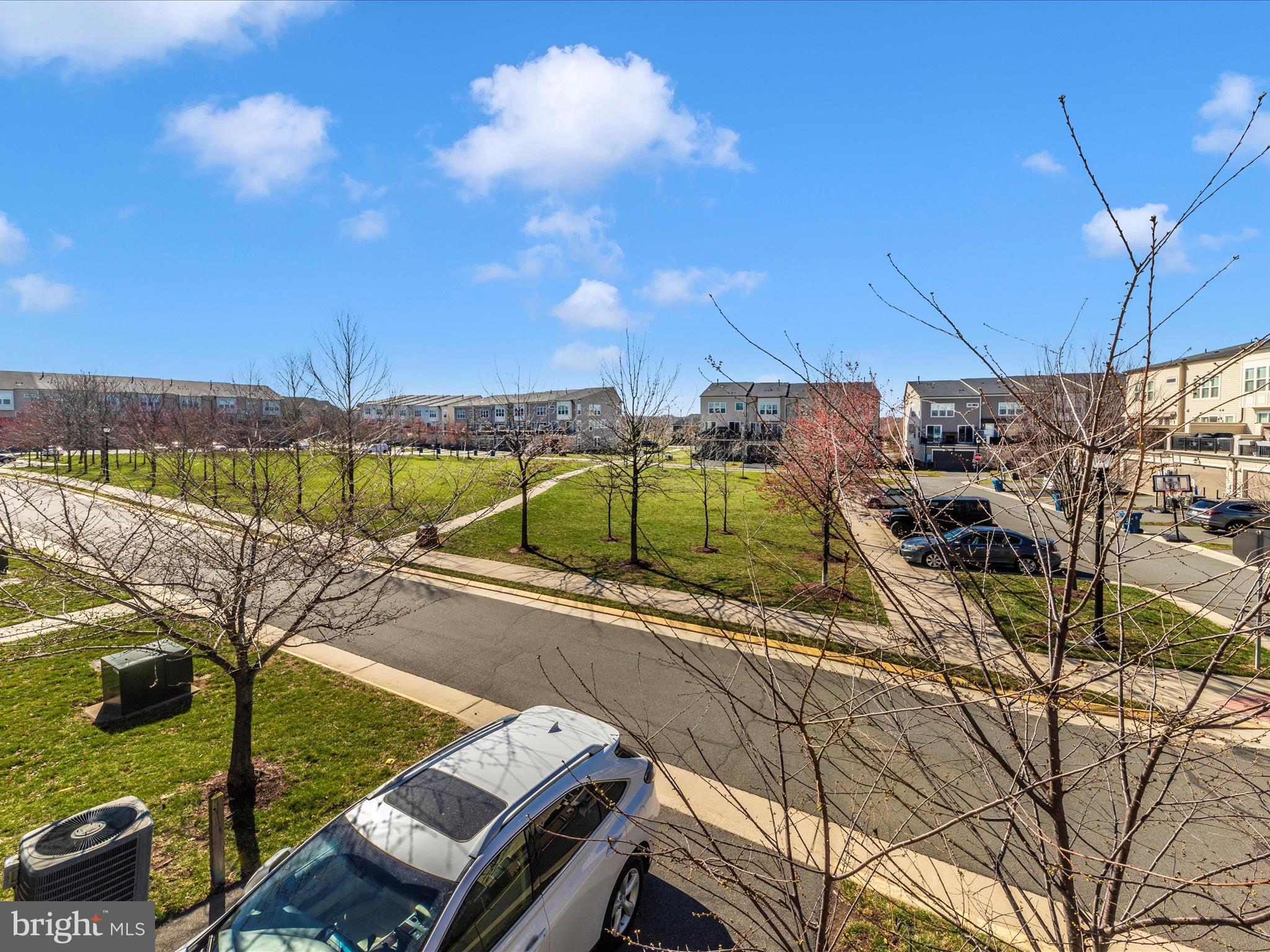 42251 Riggins Ridge Terrace Brambleton, VA 20148 - Photo 46 of 62 a view of a swimming pool with a patio