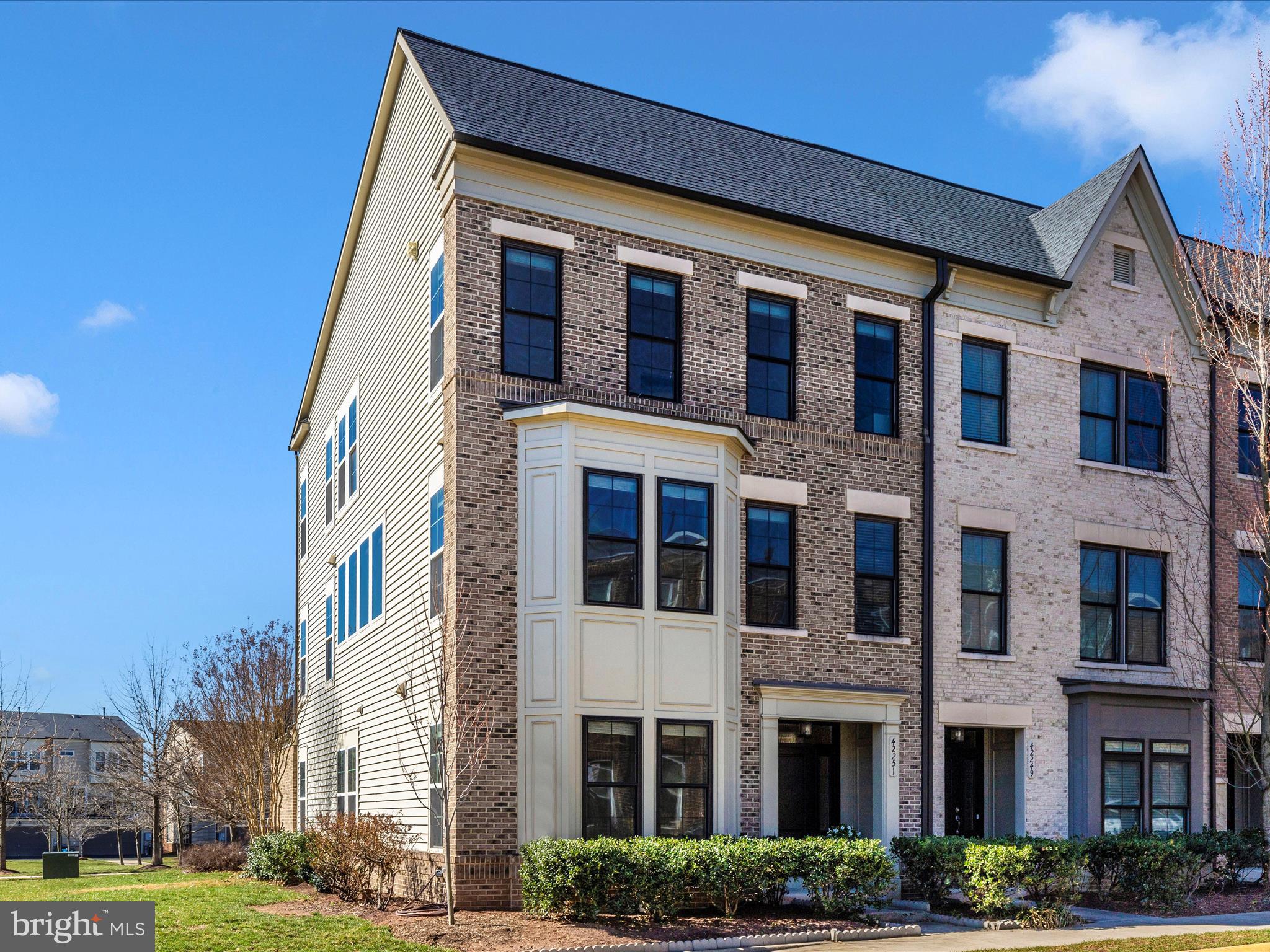 42251 Riggins Ridge Terrace Brambleton, VA 20148 - Photo 51 of 62 a front view of a building with garden