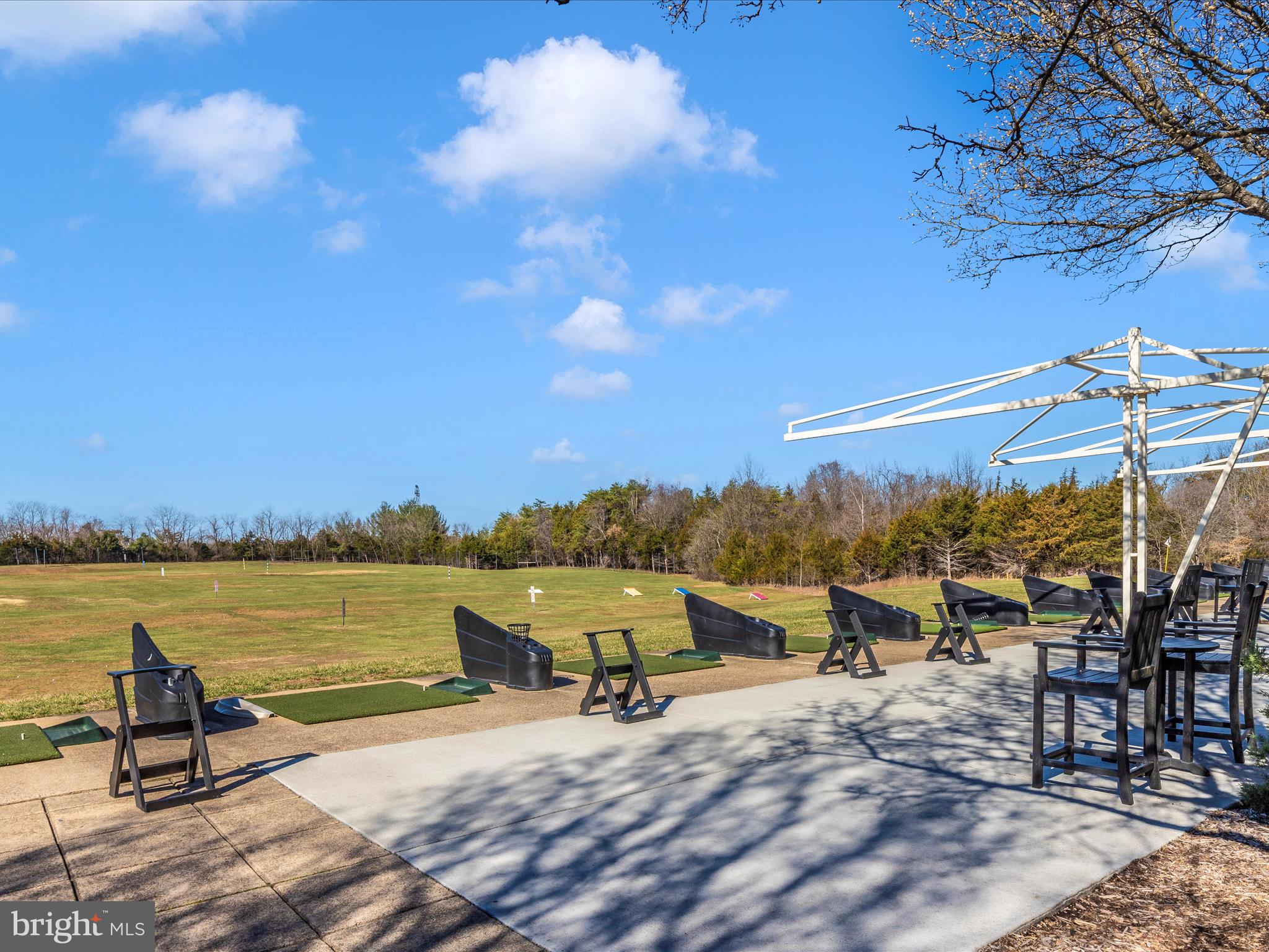 42251 Riggins Ridge Terrace Brambleton, VA 20148 - Photo 60 of 62 a view of a lake with a terrace