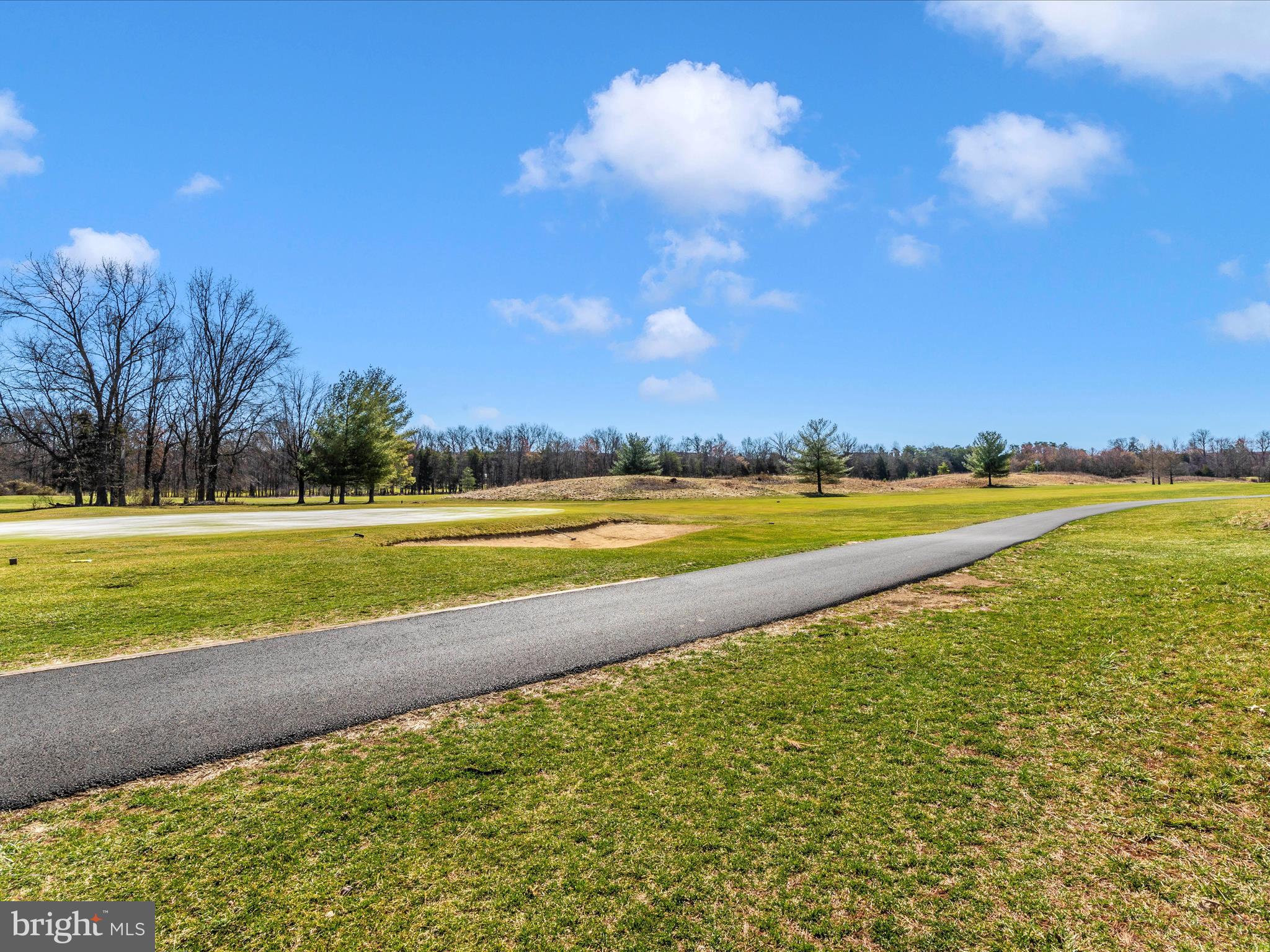 42251 Riggins Ridge Terrace Brambleton, VA 20148 - Photo 61 of 62 a view of a swimming pool and an outdoor seating