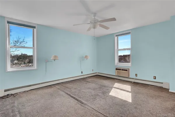 a view of an empty room with a window