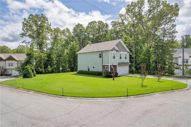 a view of pool with a garden