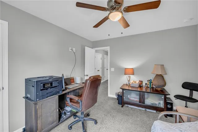 a workspace with furniture and chandelier