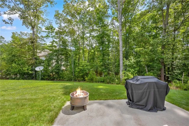 a view of a table and chairs in the garden