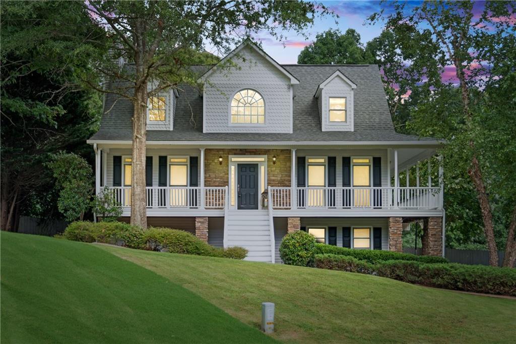 What Charm! Cape Cod/Southern Living Architecture with FULL wrap-around porch. Low Maintenance Vinyl!